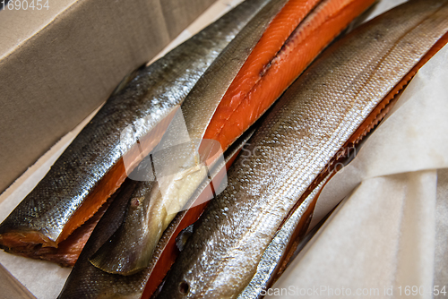 Image of Smoked fish in craft paper box.