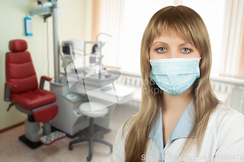 Image of Female ophthalmologist in protective mask