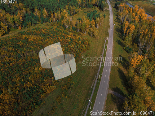 Image of Aerial view of road in beautiful autumn Altai forest