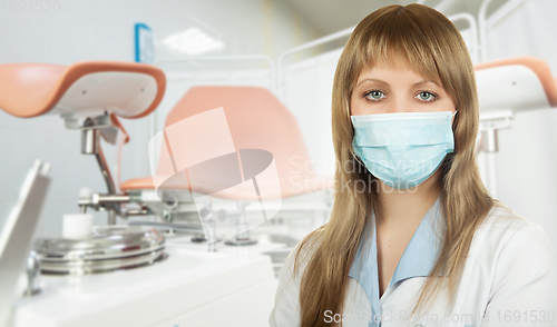 Image of Female gynecologist in protective mask