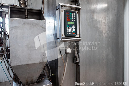 Image of Steel smokehouse with fresh smoked fish.