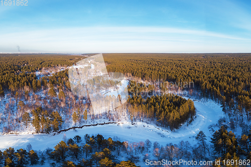 Image of Aerial view of a heart shaped winter forest