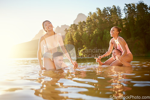 Image of Lake, happy or friends in nature swimming with freedom, men or women in summer on camping break. Smile, funny joke or excited people outdoors in river water or dam for holiday travel or vacation trip