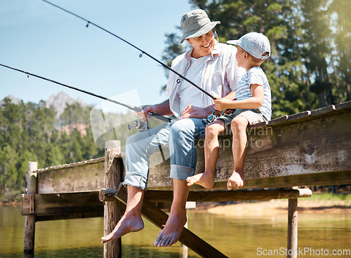 Image of Grandfather, child and smile for fishing at lake for hobby, adventure and teaching about nature. Boy kid, happy senior man and and learning to fish for fun at river, camping trip and outdoor activity