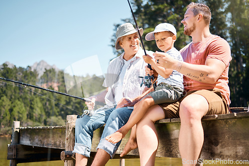 Image of Man, grandparent and fishing with son in summer on deck for holiday with bonding for weekend. Rod, grandpa and generations with boy at river for adventure with forest to relax as family with smile.