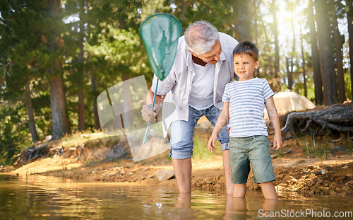 Image of Camp, child with grandfather and with fishing net at the lake in the forest outdoor with a lens flare. Happy or freedom, adventure or nature and people bonding together for health wellness at river