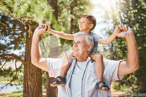 Image of Happy grandfather, child and back ride in forest for journey or family bonding together outdoors. Grandpa smile carrying kid in piggyback for holiday adventure, travel or trip in nature or woods