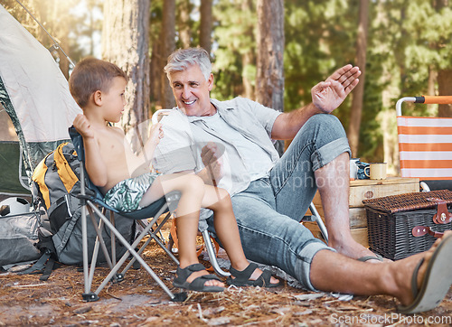 Image of Child, senior man and camping outdoor in nature with a smile, fun and family travel for summer holiday. Happy grandpa and kid camper talking at a camp site, forest or woods with love for adventure
