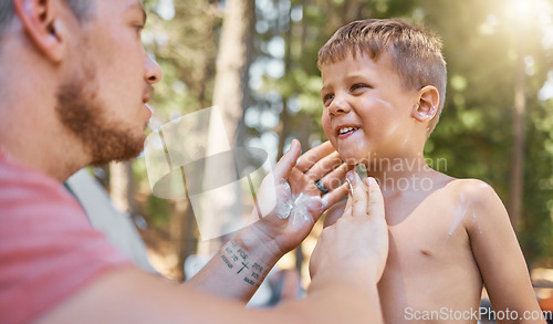 Image of Father apply sunscreen on child face for protection or safety while camping in a forest or woods for vacation or holiday. Lotion, cream and dad care for kid with skincare product in outdoor adventure