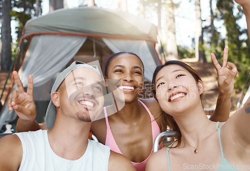 Image of Smile, peace sign and selfie of friends camping in forest, woods or nature together. Happy, v hand and people taking picture for hiking, social media emoji or group memory outdoor on summer vacation.