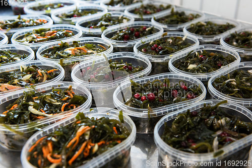 Image of Different fish and chuka wakame laminaria seaweed salad