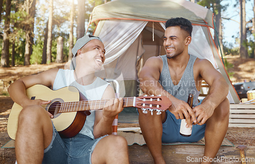 Image of Men, friends and guitar for camping in woods with smile, singing and beer for drink, relax and holiday. Young male students, musician and happy people with instrument, creativity and art in forrest