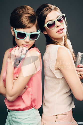 Image of Fashion, beauty and retro with portrait of women in studio for elegant, pastel and vintage. Sunglasses, confident and cosmetics with female model on dark background for glamour, beehive and style