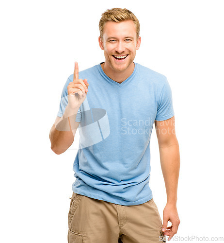 Image of Happy, pointing up and portrait of a man in studio for announcement, presentation or choice. Male model with hand gesture or sign for advertising, promotion or marketing on a white background