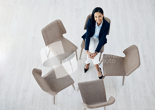 Image of Business woman, waiting room and sitting on chair above for meeting, huddle or appointment at office. Top view of happy female person or employee in hiring, interview or social group at the workplace