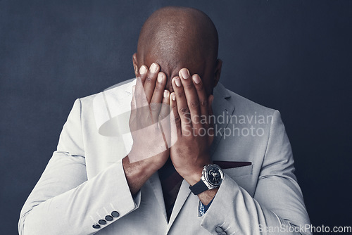 Image of Sad, stress and business man crying, frustrated or depressed for financial mistake, debt or crisis. Corporate person with bankruptcy for finance fail or stock market crash isolated on dark background