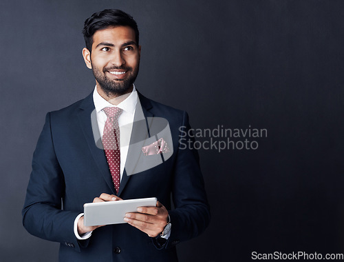 Image of Happy businessman, tablet or thinking in studio on mockup space of trading ideas, mindset or planning goals. Corporate trader, indian man or remember decision with digital technology, vision or smile