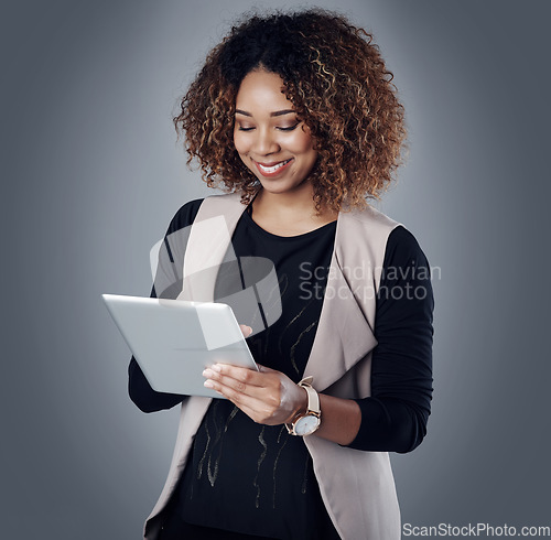 Image of Online communication, businesswoman with tablet and against a studio background for accounting. Technology or connectivity, finance and woman accountant happy for financial report or data review