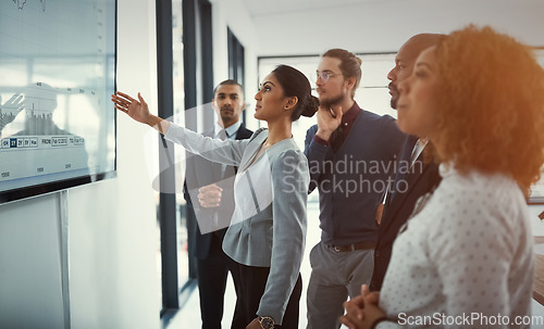 Image of Data review, colleagues in a business meeting and planning in a boardroom of their workplace. Analytics or statistics, collaboration or teamwork and people in a office for strategy or presentation