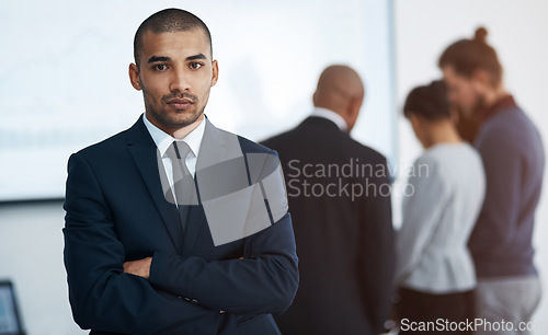 Image of Serious, business man and arms crossed office portrait in a corporate board room with professional management. Executive and African male manager at a workplace with leadership and job vision