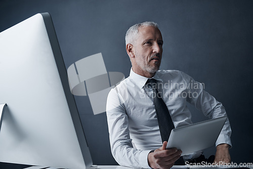 Image of Tablet, computer and business man at desk working on online project, planning and writing email. Corporate worker, thinking and mature male person with digital tech for review, website and research