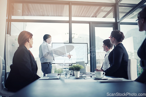 Image of Presentation, proposal and executive team in a meeting for a report or corporate workshop for sales in a company. Board, manager and business man or speaker pointing at growth or development strategy