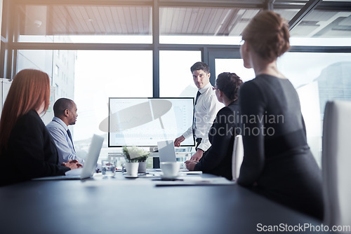 Image of Monitor, businessman or speaker in a presentation for graphs report or charts data analysis in company. Meeting, manager or mentor planning sales growth on screen in training, mentorship or coaching
