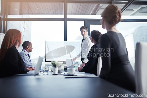Image of Monitor, businessman or leader in a presentation for graphs report or charts data analysis in company. Meeting, manager or speaker planning sales growth on screen in training, mentorship or coaching