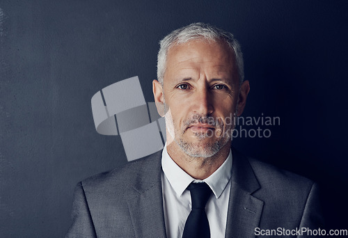 Image of Serious, senior and portrait of business man in studio for professional, corporate or manager. Boss, pride and confidence with face of male ceo on black background for executive and mockup space