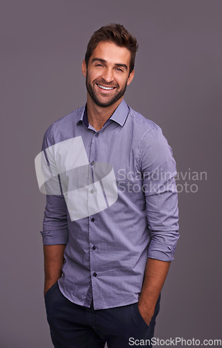 Image of Portrait, auditor and happy business man in studio isolated on a gray background. Smile, confident and person, professional or accountant from Canada with trendy clothes, fashion and hands in pocket.