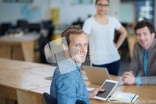 Image of Teamwork, portrait or happy developers in meeting for discussion or brainstorming together in office. Diversity, digital app or programmers networking with technology, tablet or laptop in workplace