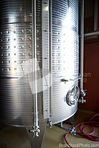 Image of Beer tank, machine and manufacturing plant for alcohol with steel container for liquor. Metal, wine fermentation and drum in a factory company with brewery equipment and drink at a distillery