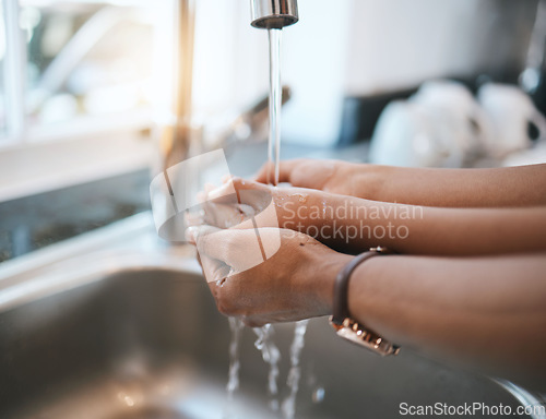 Image of Washing hands, kitchen and parent with a child in their home for hygiene or cleaning at the sink. Children, water and tap with a kid learning about protection from an adult person in their house