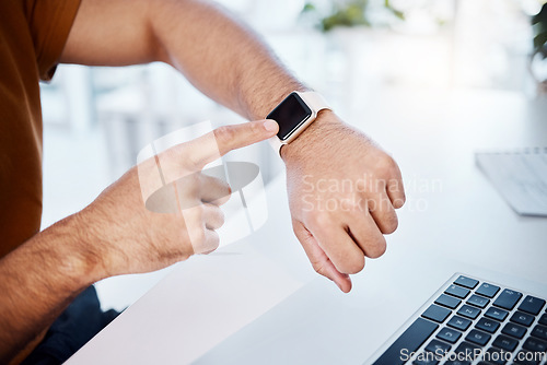 Image of Time check, work and hands of a man with a watch for a notification, reading information or email. Business, busy and arm of a businessman checking a digital clock while working on a laptop in office