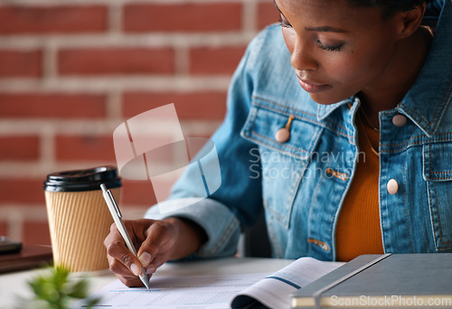 Image of African woman, writing and documents at startup with information, signature or contract on desk. Girl, pen and paperwork for compliance, insurance and reading for audit, taxes or legal admin at job