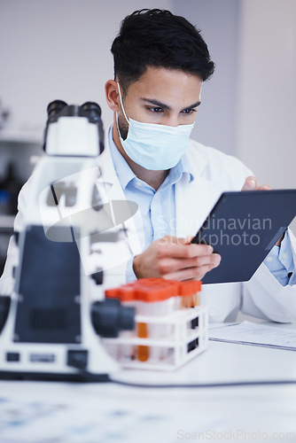 Image of Blood test, tablet and scientist man with research analysis, vaccine and healthcare, face mask and laboratory data. Medical, science doctor or person with digital technology for covid or dna results