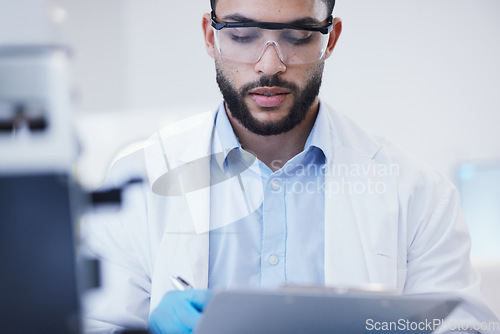 Image of Results, man or scientist writing research notes for analysis on experiment, information or innovation. Biologist, biotechnology or researcher in a laboratory with documents for science development