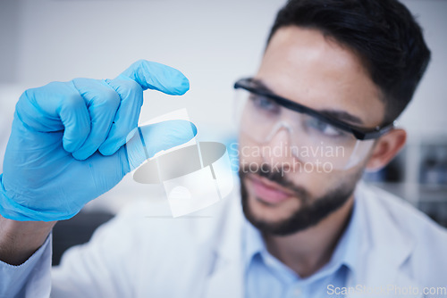 Image of Laboratory, man or hand of scientist with small size for research, assessment or experiment innovation. Healthcare, science blur or biologist with little scale gesture for future development results