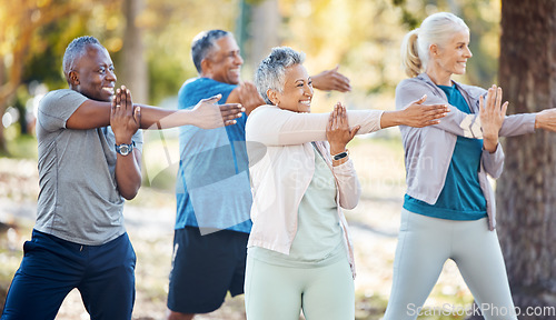 Image of Fitness, group and senior people stretching before a exercise in an outdoor park or nature. Sports, wellness and elderly friends doing a arm warm up workout before training class together in a garden