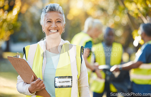 Image of Clipboard, volunteering portrait and woman in park cleaning, community service and pollution or waste checklist. Pollution, inspection and senior person or manager in ngo or nonprofit project outdoor