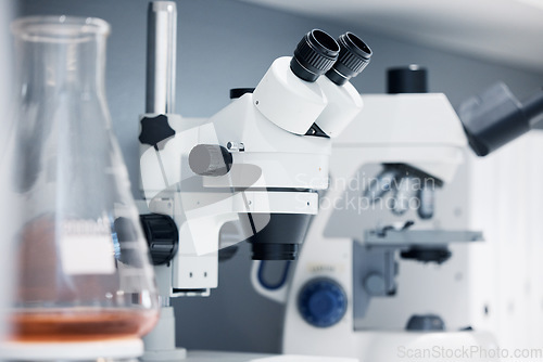 Image of Science, laboratory and microscope with pharmaceutical test for healthcare study and medicine. Medical tools, research and innovation in health care, biotechnology and zoom on chemical investigation.