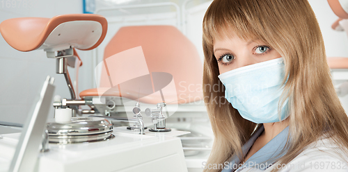 Image of Female gynecologist in protective mask