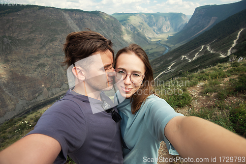 Image of Loving couple together on mountain