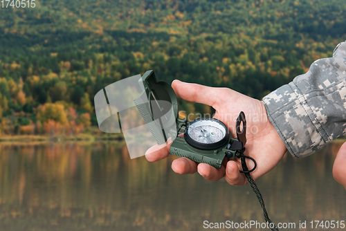 Image of Man with compass in Altai mountains