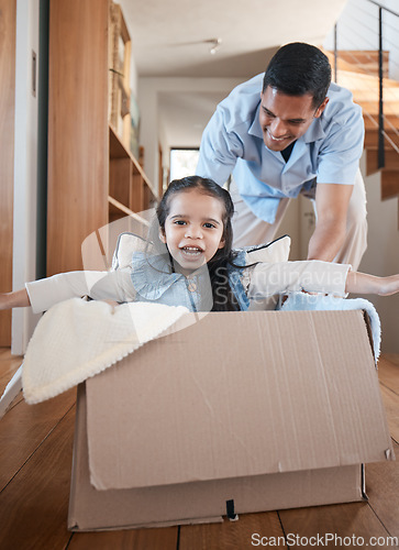 Image of Dad, child and box, playing on floor in home with love and fantasy for happy family with smile and fun. Cardboard ride, playful bonding and father with girl in new house, games and adventure for kids