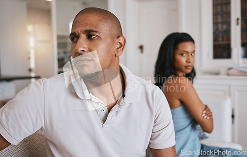 Image of Couple, fight and frustrated on living room couch for worry, mistake or angry with anxiety in house. Man, woman or depression for conflict, drama or stress on lounge sofa for cheating, crisis or fail