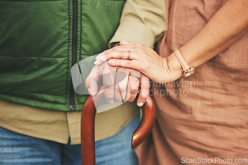 Image of Closeup, hands and couple with support, cane and retirement with solidarity, marriage or appreciation. Zoom, touching or senior man with old woman, love or care with empathy, understanding or comfort