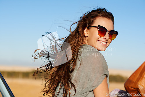 Image of Travel, road trip and young woman with sunglasses for a summer vacation or weekend adventure. Happy, smile and female person having fun with freedom while in nature for an outdoor holiday or journey.