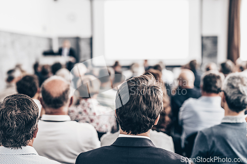 Image of Business speaker giving a talk at business conference event.