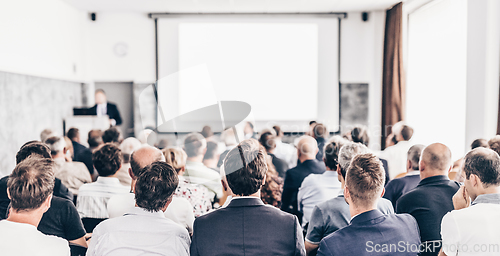 Image of Business speaker giving a talk at business conference event.